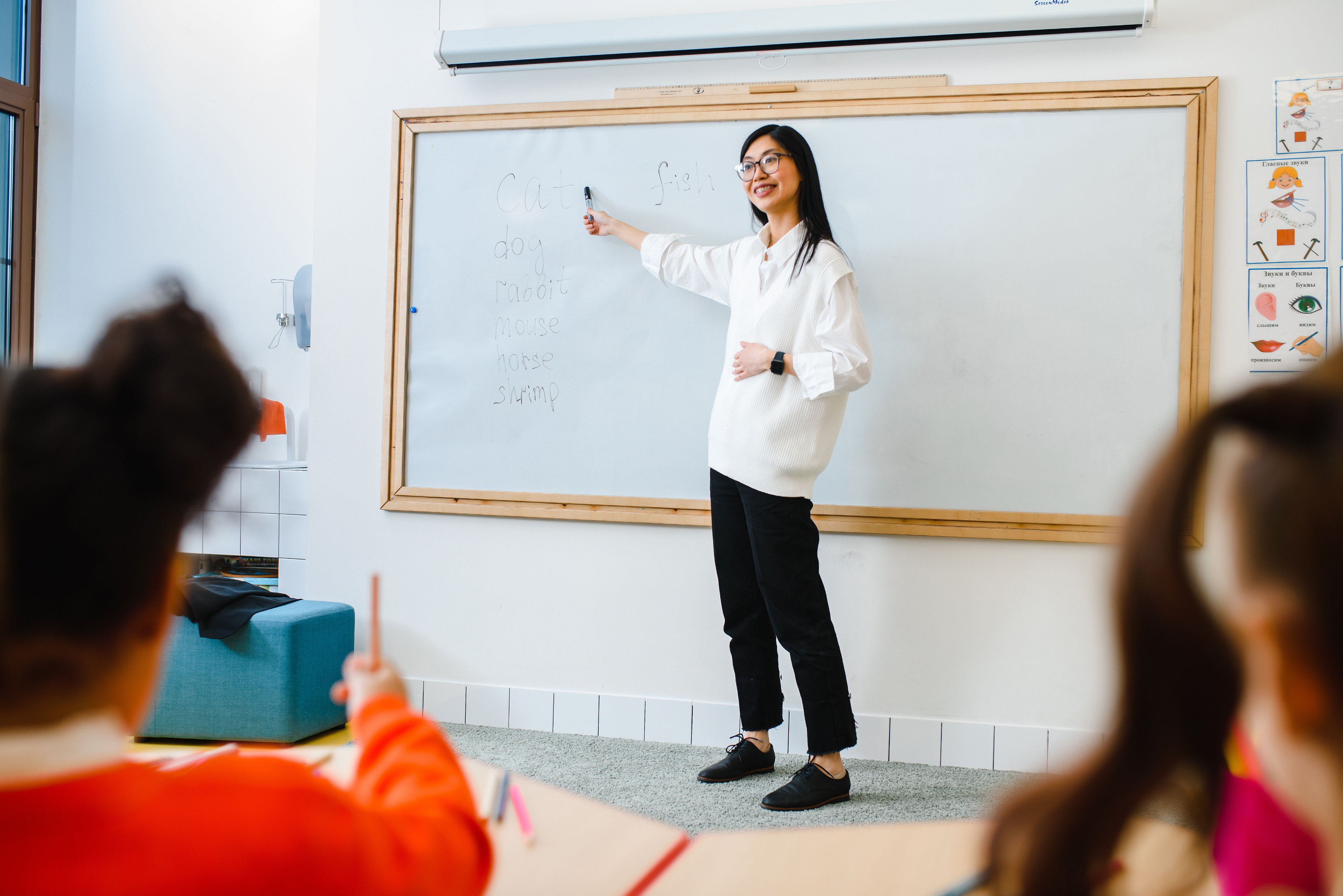 Teacher presenting to students in a classroom
